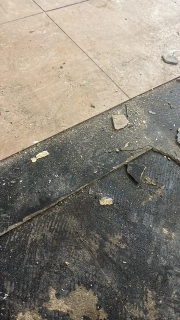 Black bitumen mastic floor removal in a SE21 flat